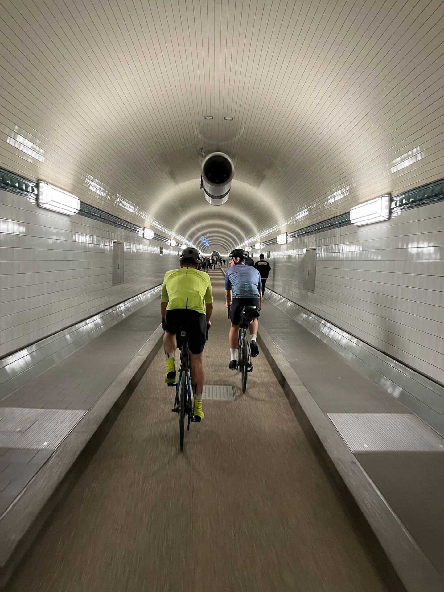 Cyclists in the St. Pauli Elbtunnel approaching Hamburg